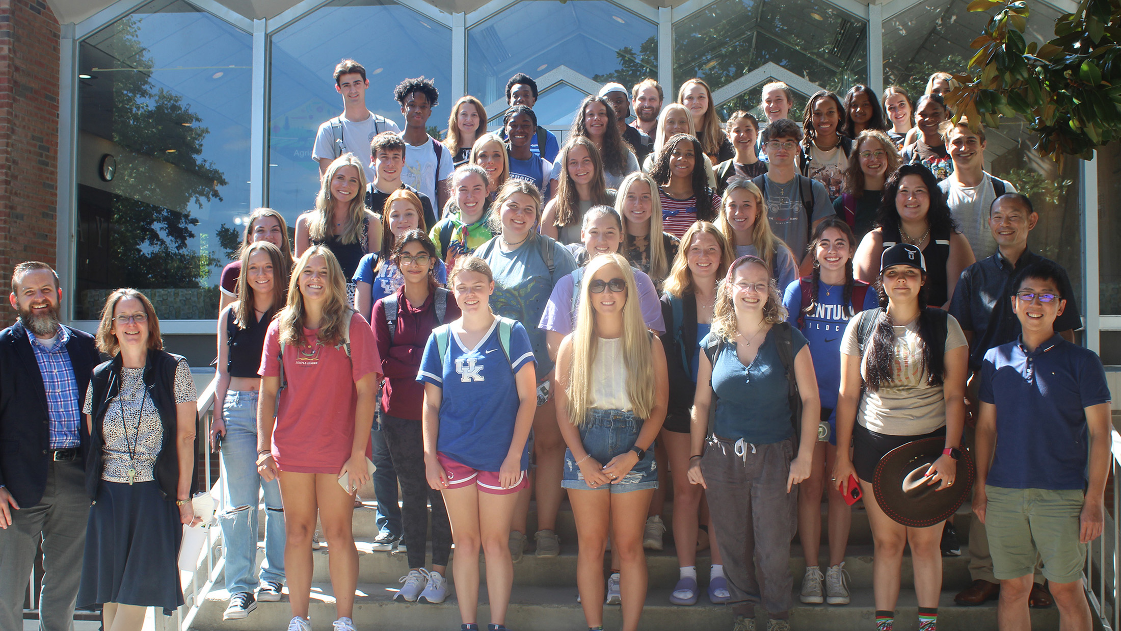 A group of ABT students stand on a stairway